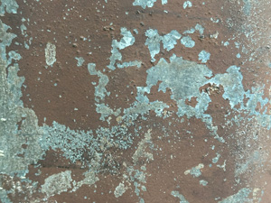 Metal surface with paint cracked and peeling