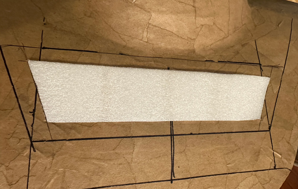 A view of the white foam inside of the cut-out panel on the chest