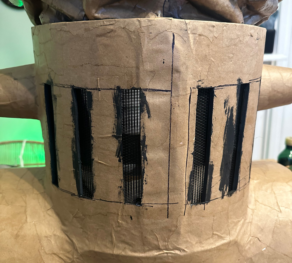 Back view of the mask, showing vertical holes for ventilation