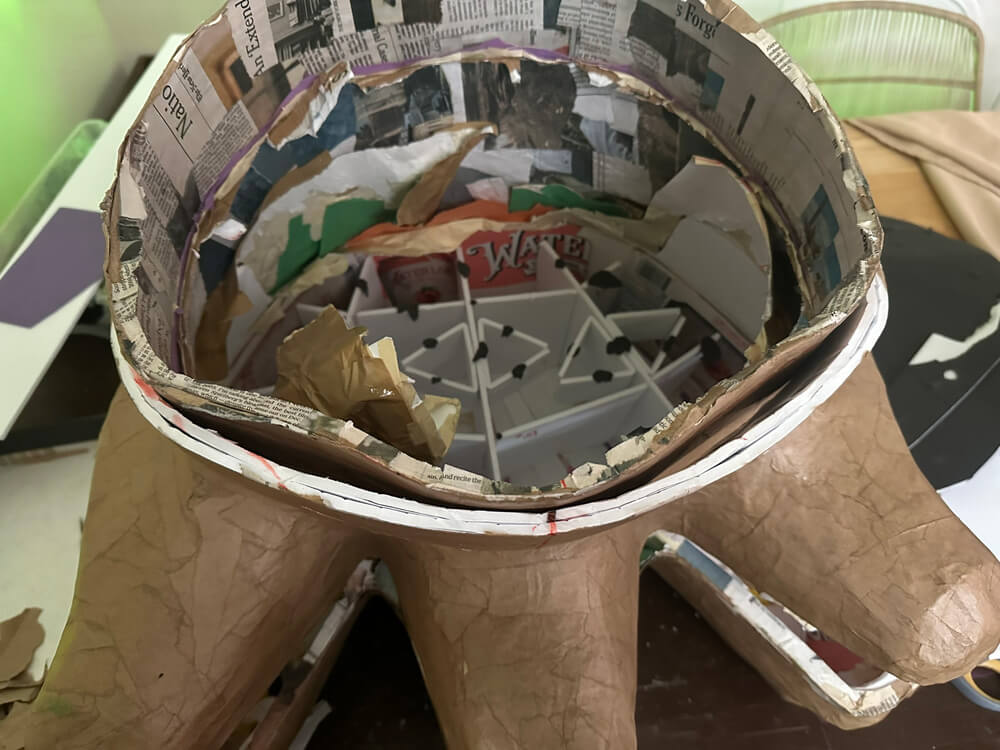 Mask is upside down and about half of the materials are removed; some of the foam bits are still inside