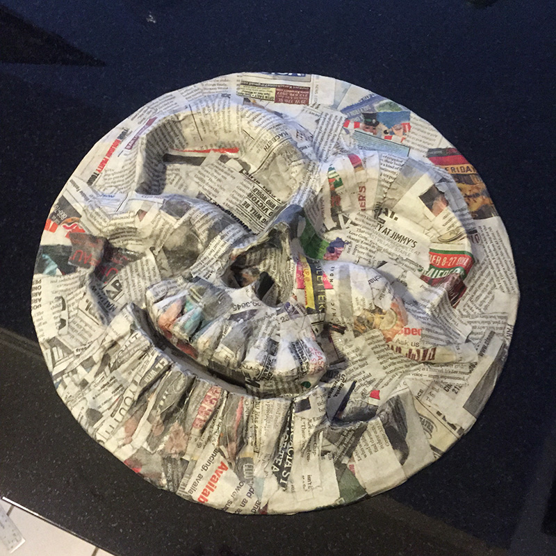 Cuckoo clock skull mask - first layer of papier mache