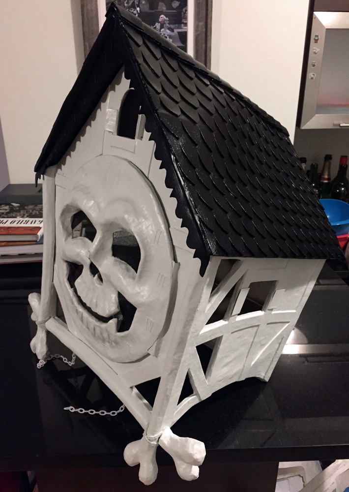 Cuckoo clock skull mask - side view of painted pieces
