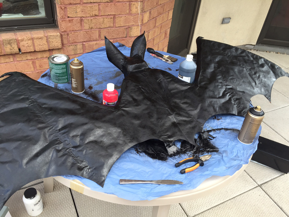 Papier mach&eacute; bat -- black spray paint base coat
