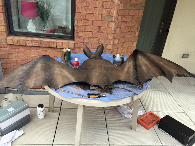 Papier mach&eacute; bat -- brown spray paint on the back