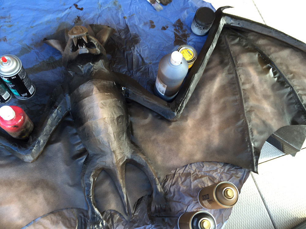 Papier mache bat -- brown spray paint on the front