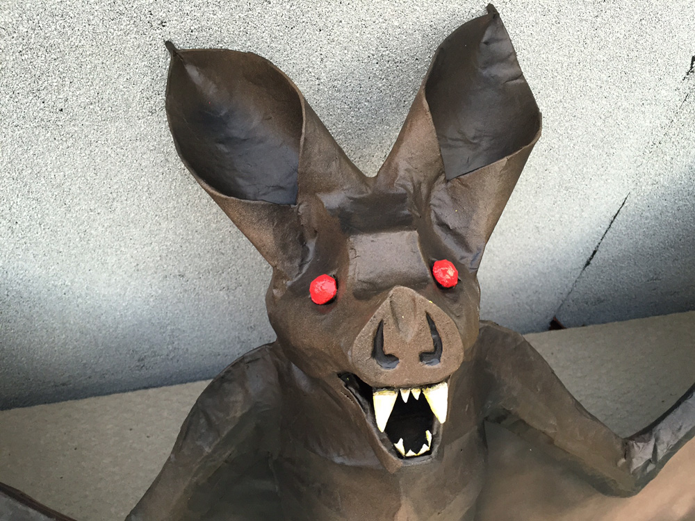 Papier mach&eacute; bat -- painting the eyes and teeth