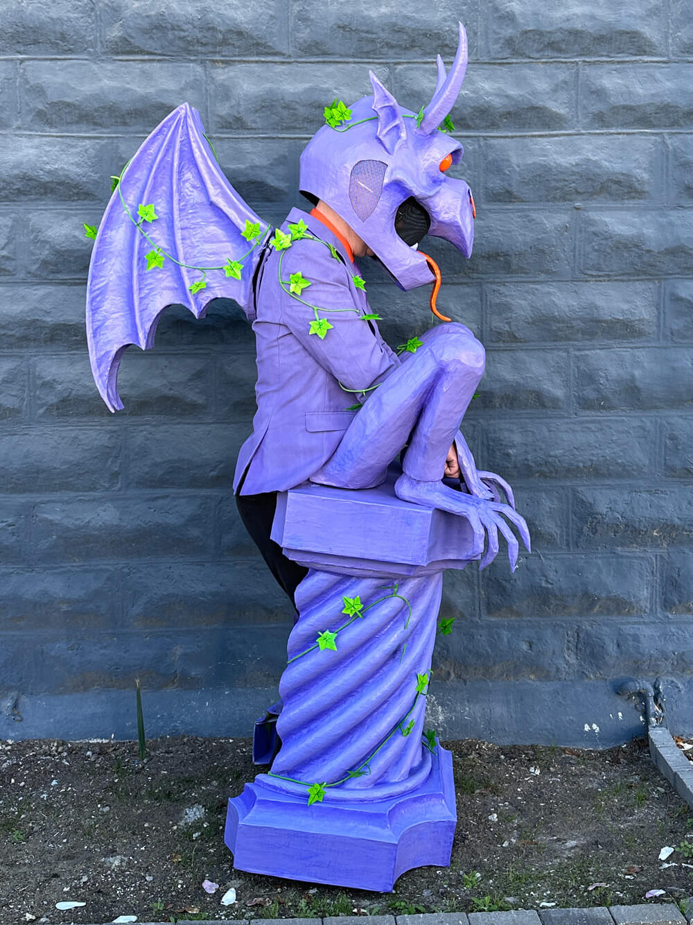 Side view of the gargoyle costume showing the wings.