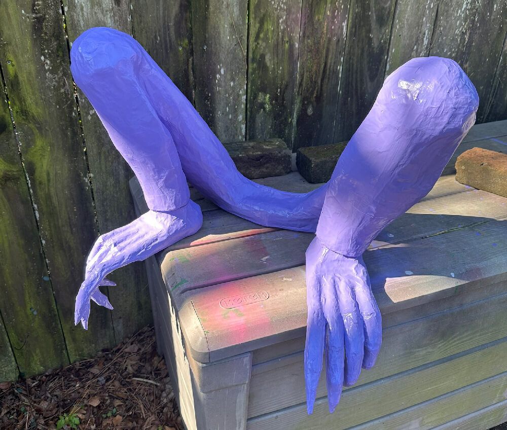 Gargoyle legs after being spray painted purple
