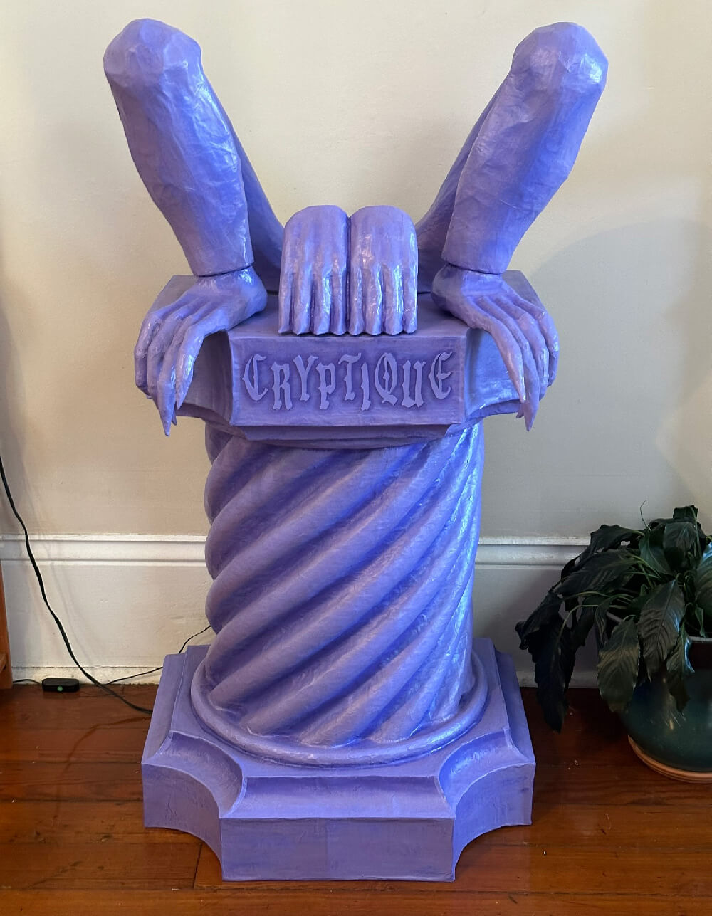 Some of the gargoyle parts painted and assembled: the column, legs, and hands.