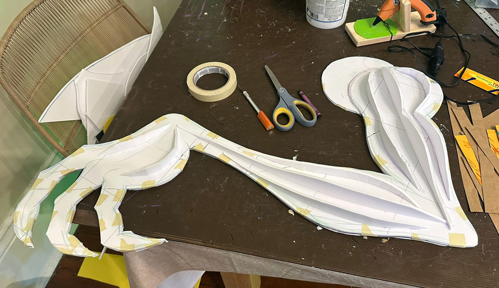 The Jabberwocky's arm in progress; here it's a foat foam board shape with some small vertical foam board ridges running along it.