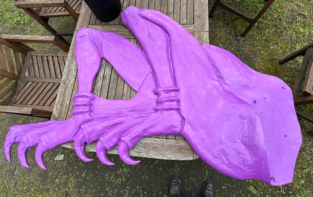 The legs component spray-painted a bright pink/purple color.