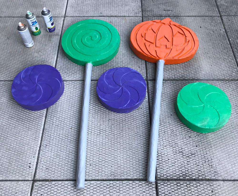 Spray painted giant candies drying