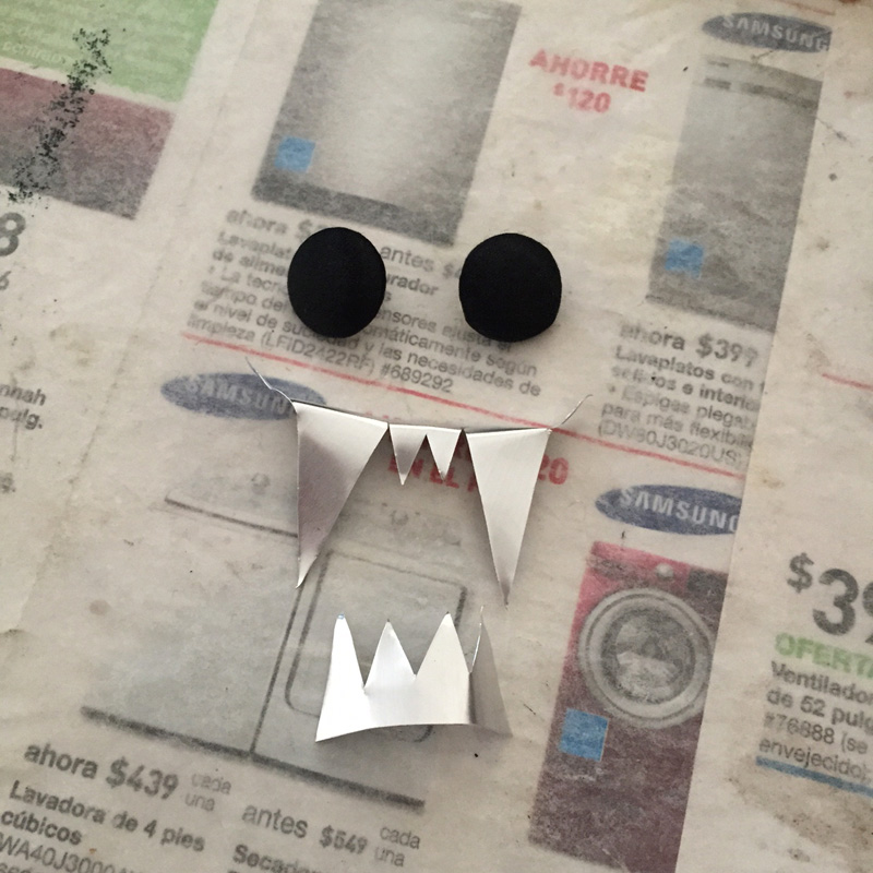 Papier mache bat -- teeth and eyes