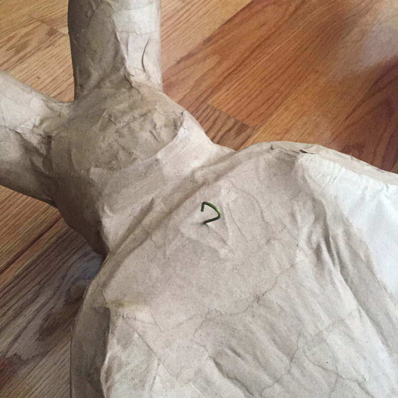 Papier mache bat -- installing the hook in the back