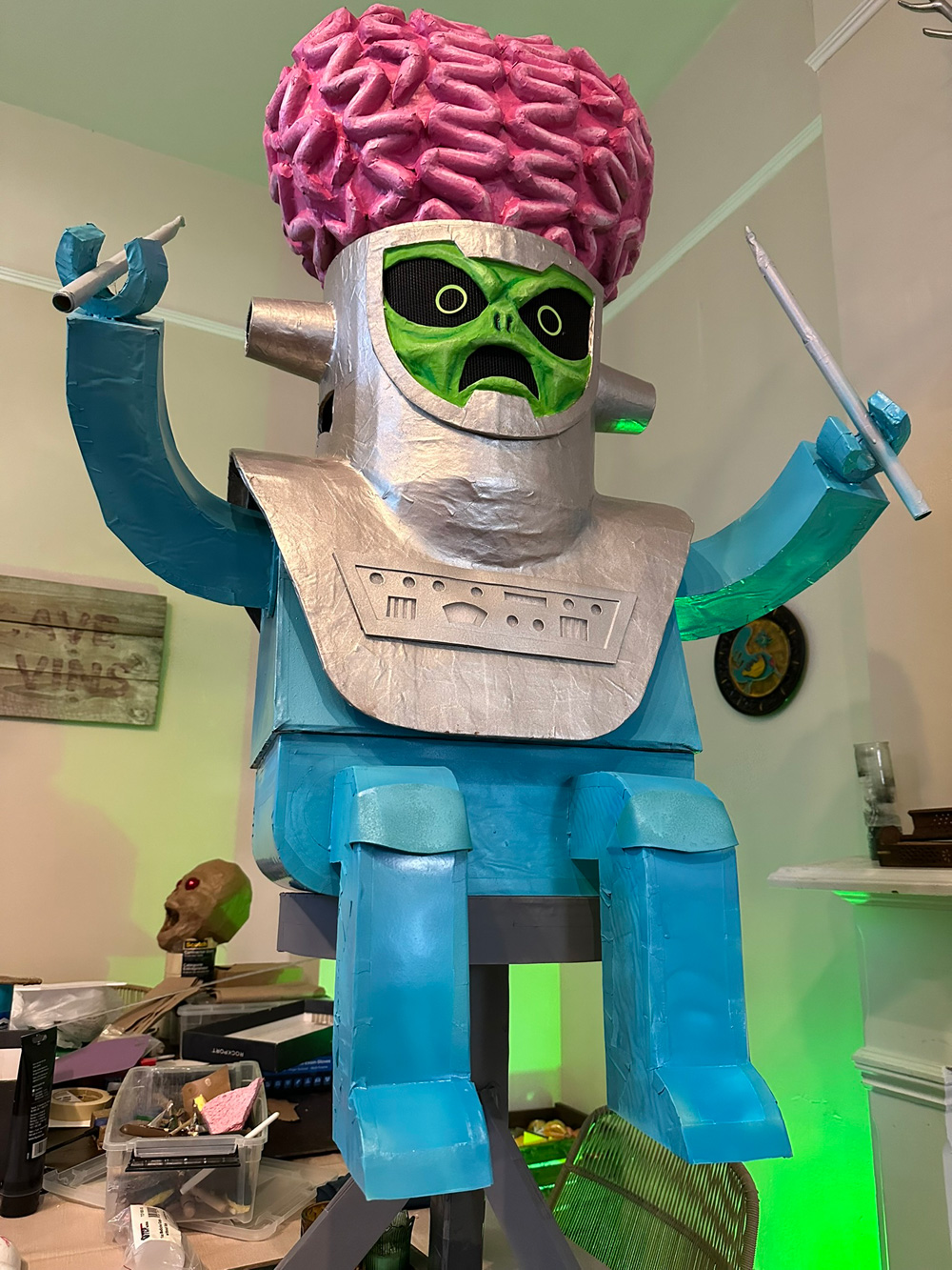 The alien sitting on my dining room table without his drums