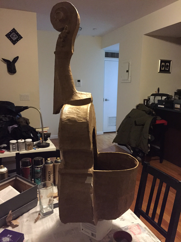 Inserting the hard hat into my paper mache violin skull mask