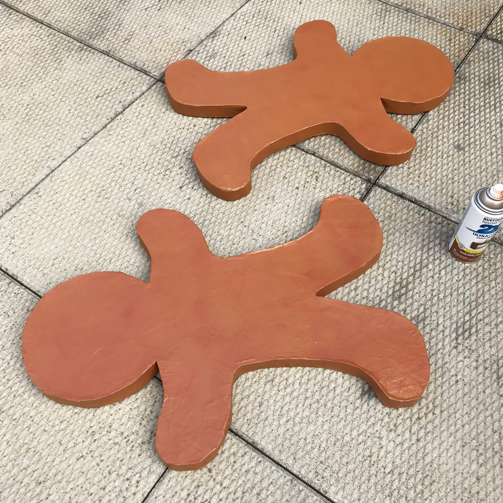 Paper mache gingerbread men - spray painting