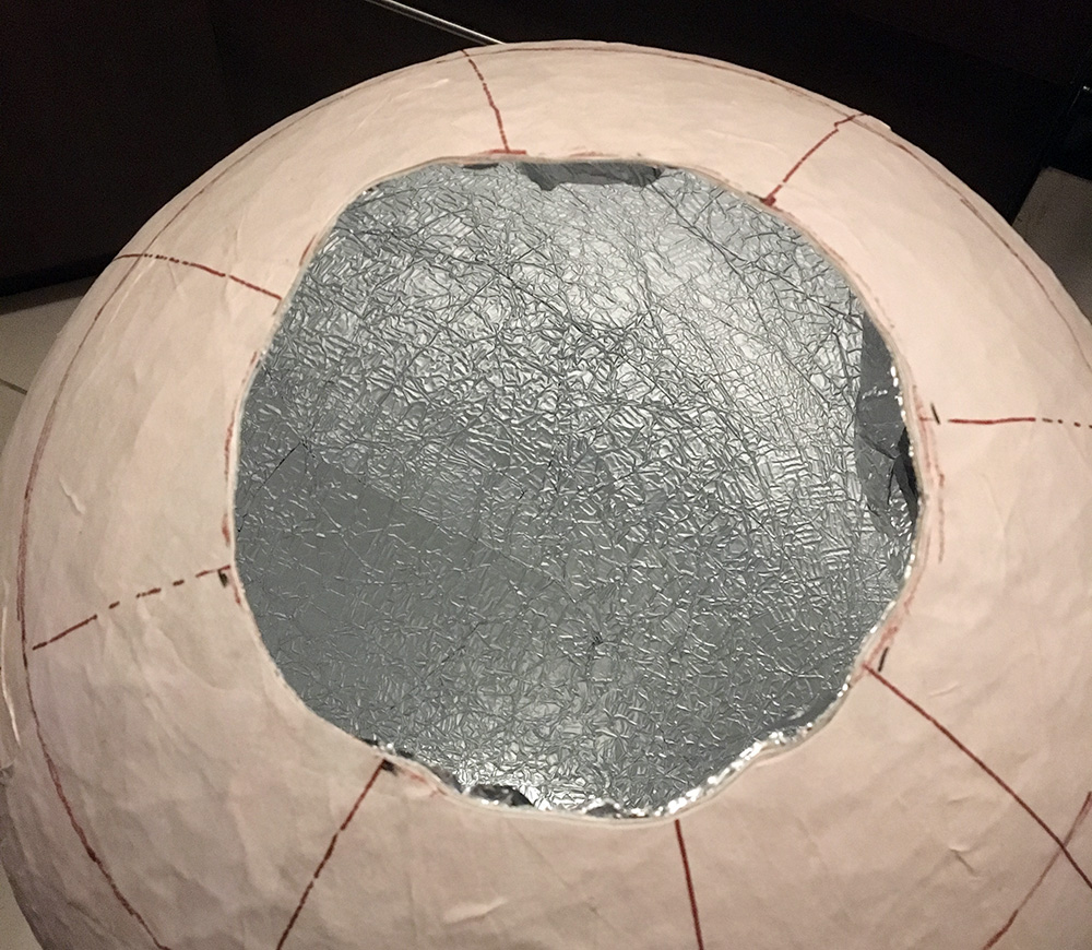 Paper mache globe - opening up the paper mache