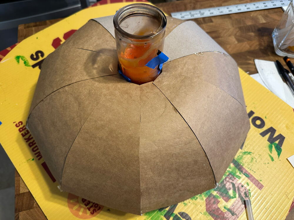 The pasteboard wedges are all in place; the thing looks like a bundt cake now.
