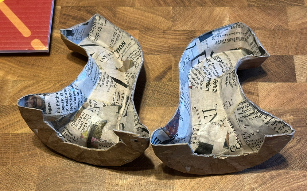 The paper mach&eacute; stem, split in two and hollowed out.