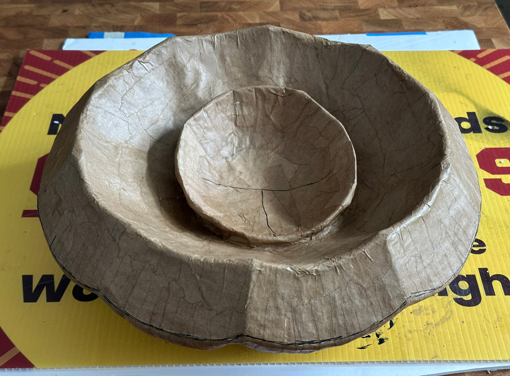 Bottom view of the pumpkin lid showing the smaller bowl shape in place.
