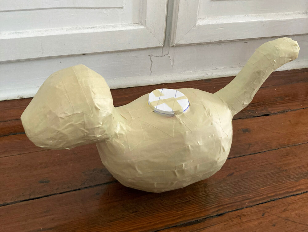 Tiger pinata sculpture - covering the tiger with masking tape