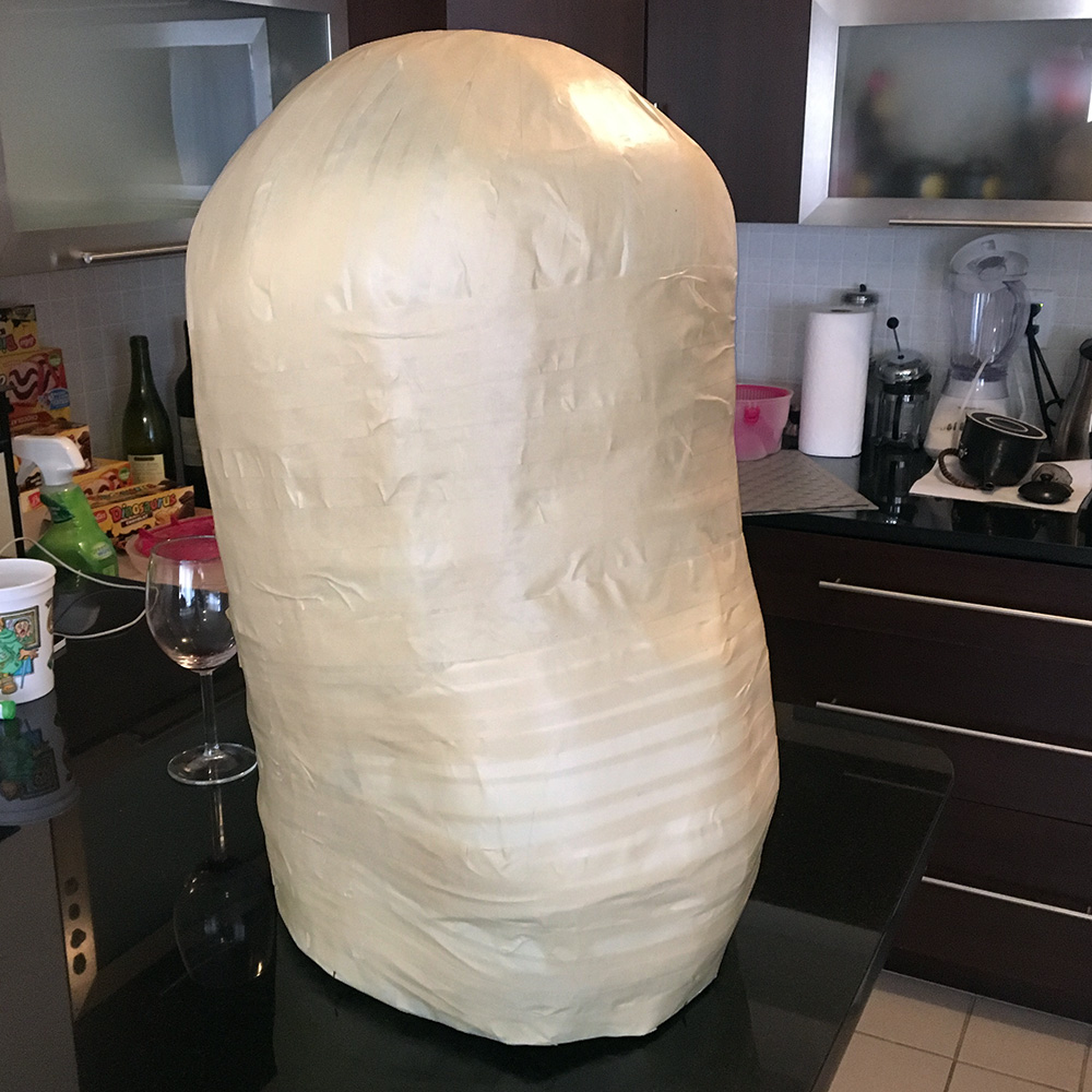 Twin paper mache skull masks - covering the base with masking tape