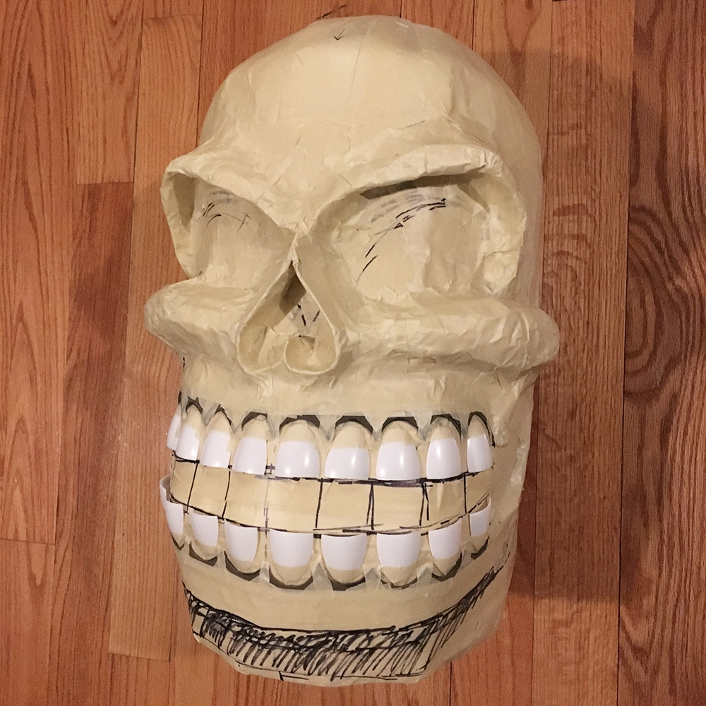 Twin paper mache skull masks - the finished base with teeth