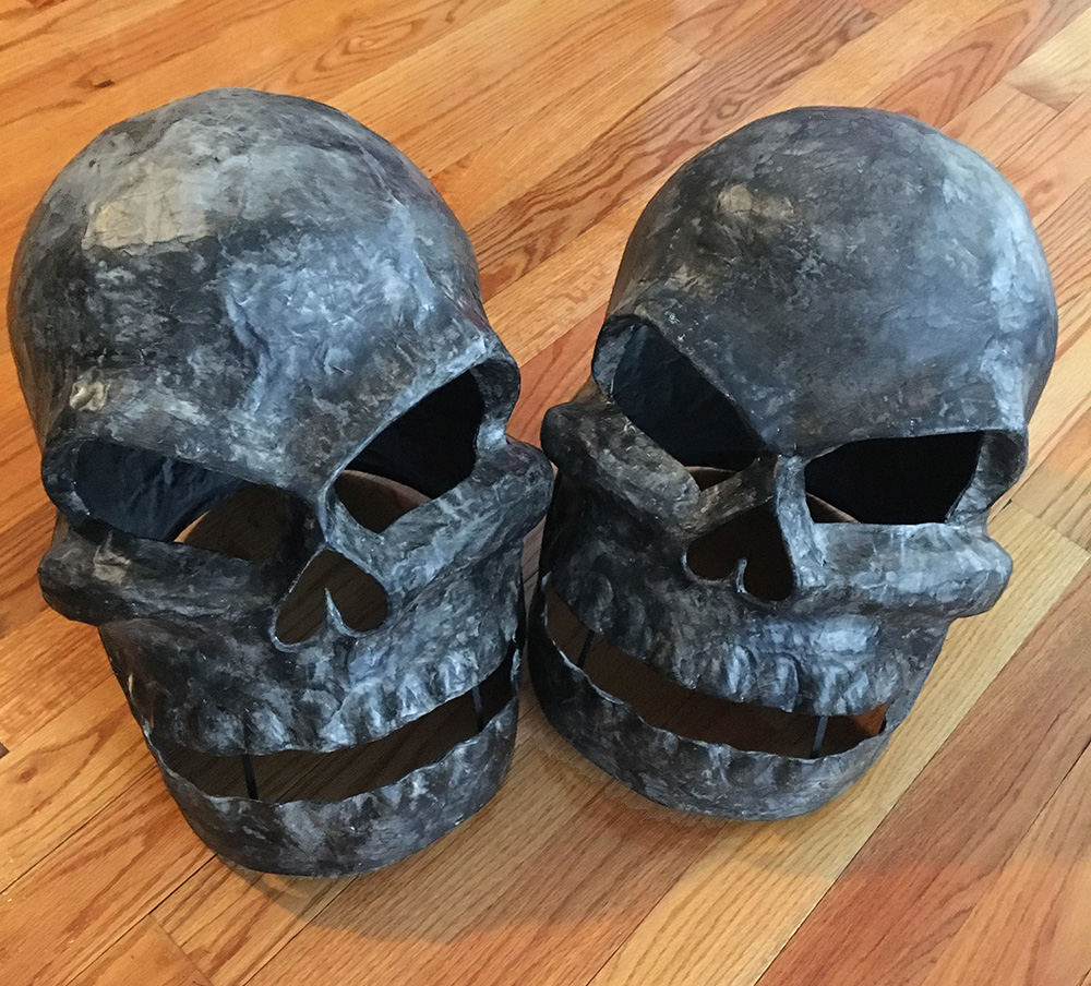 Twin paper mache skull masks - painting shadows