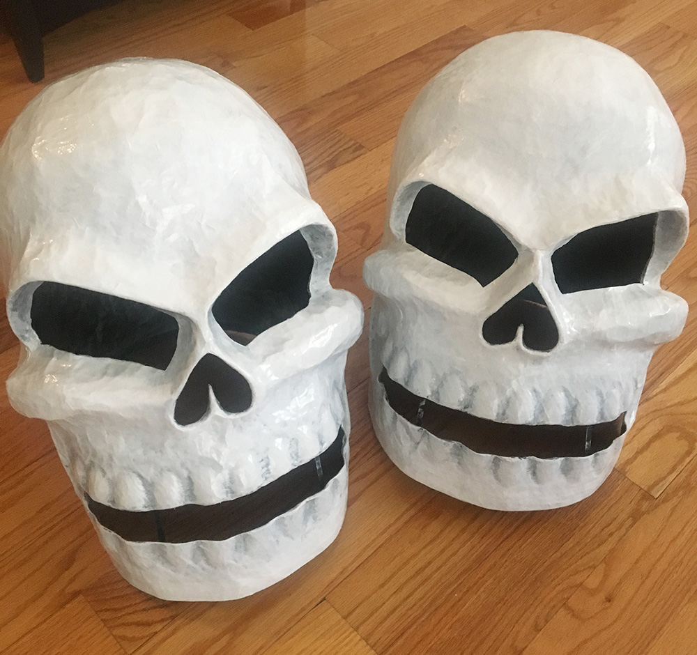Twin paper mache skull masks - dry brushing