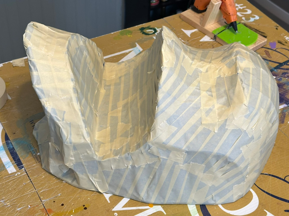 The armature is now covered with a skin of masking tape.